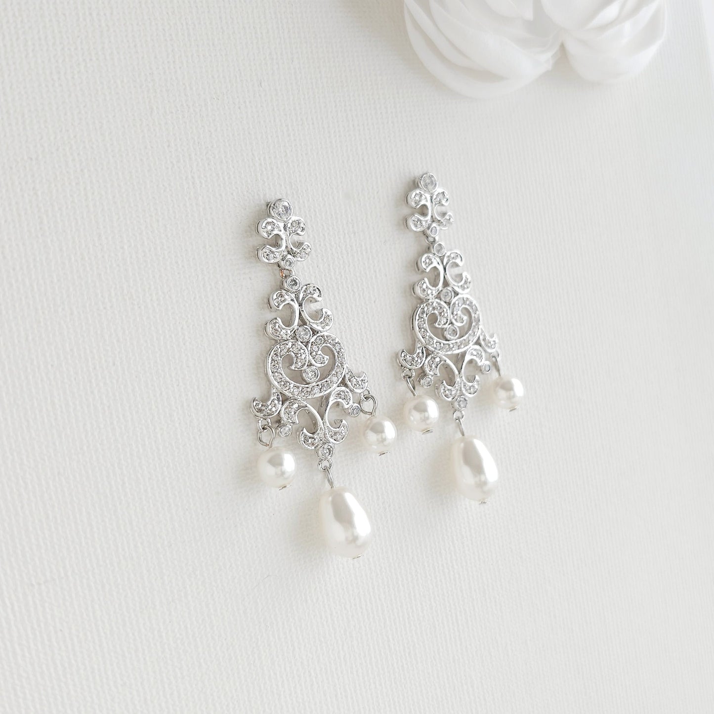Silver filigree dangle earrings style: with Lightweight silver vintage style pearl drop chandelier earrings featuring cubic zirconia and flawless round crystal pearls.